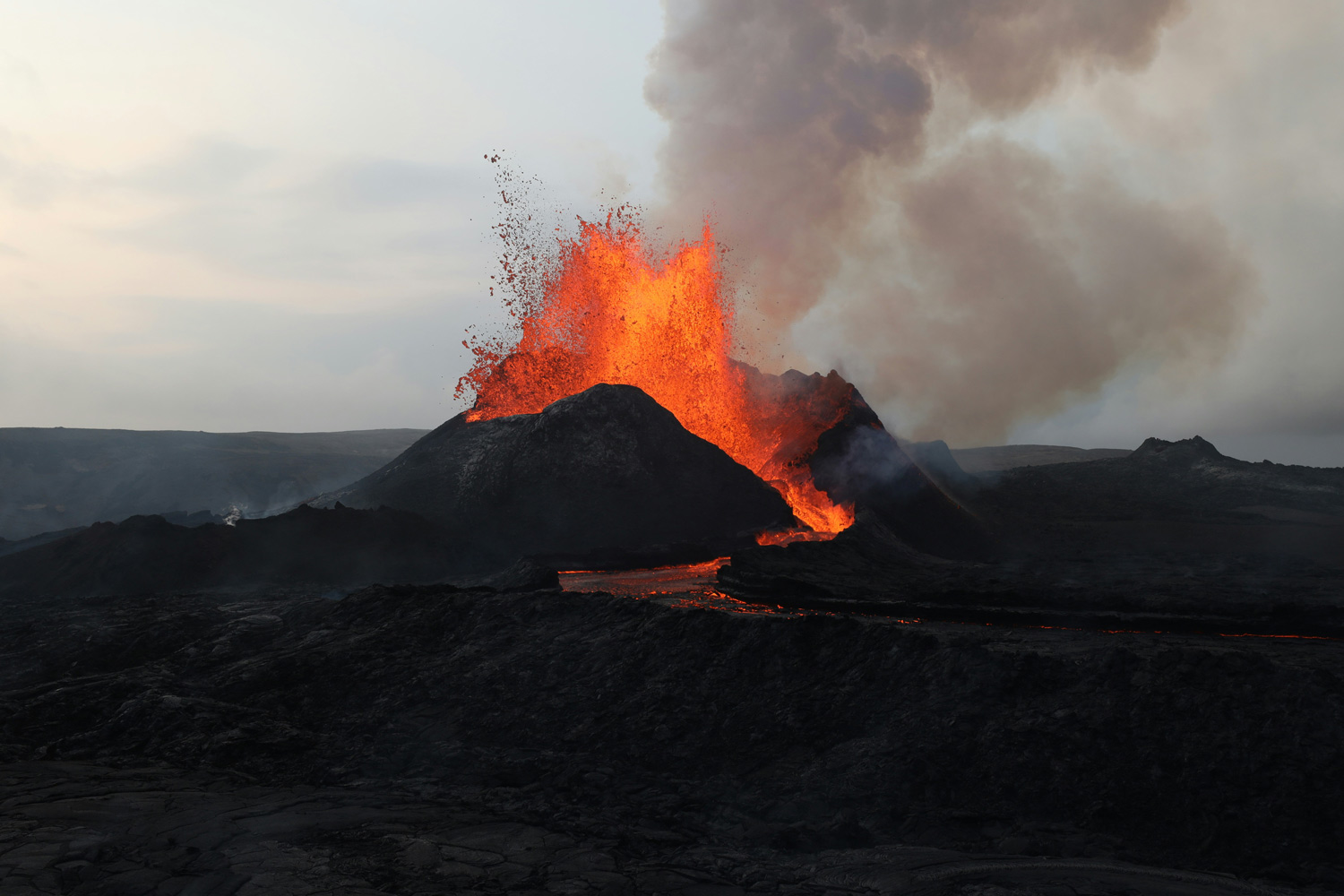 Hawaiian volcano with lava and black earth